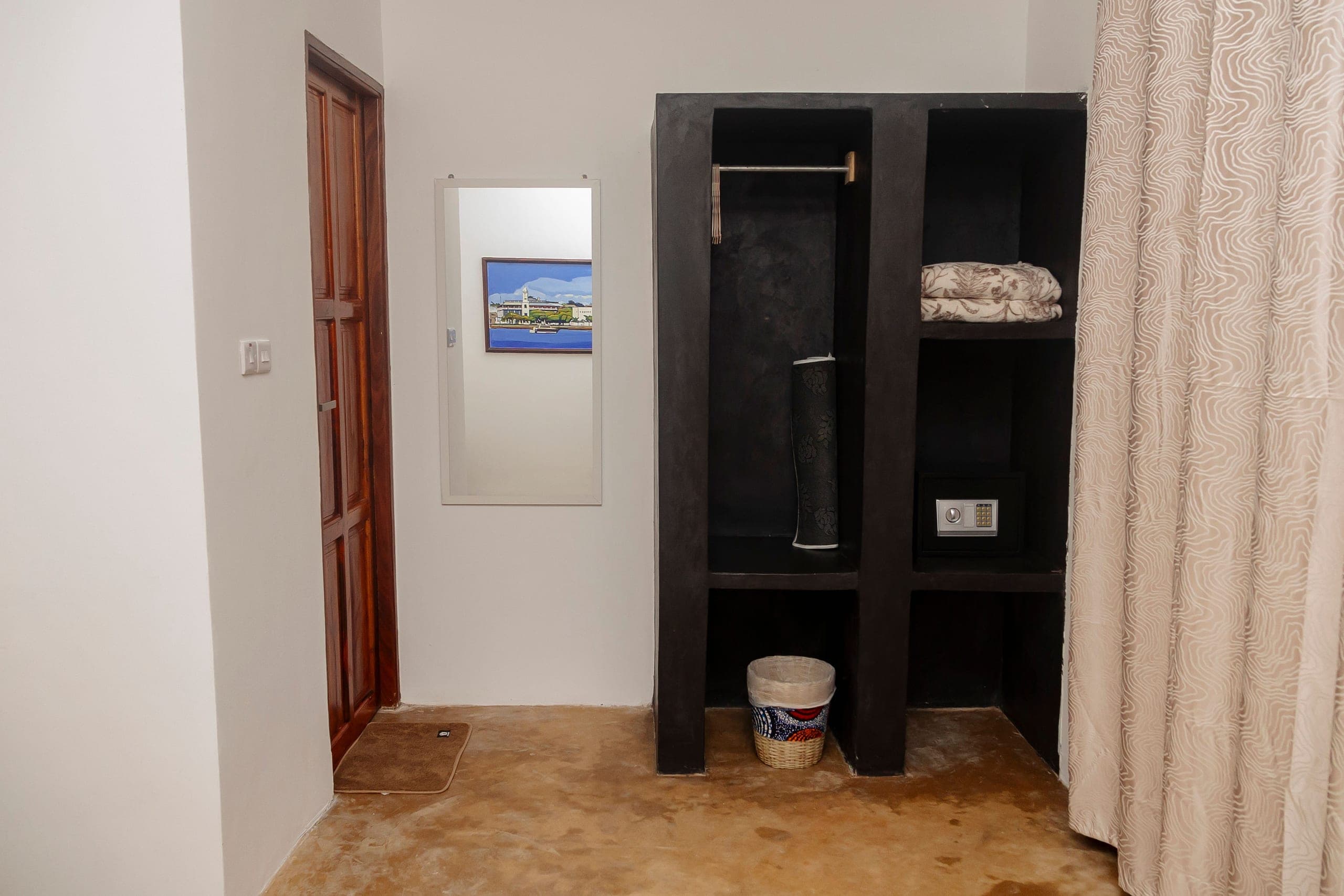 Wardrobe alcove with hanging space, a safe box and a full length mirror