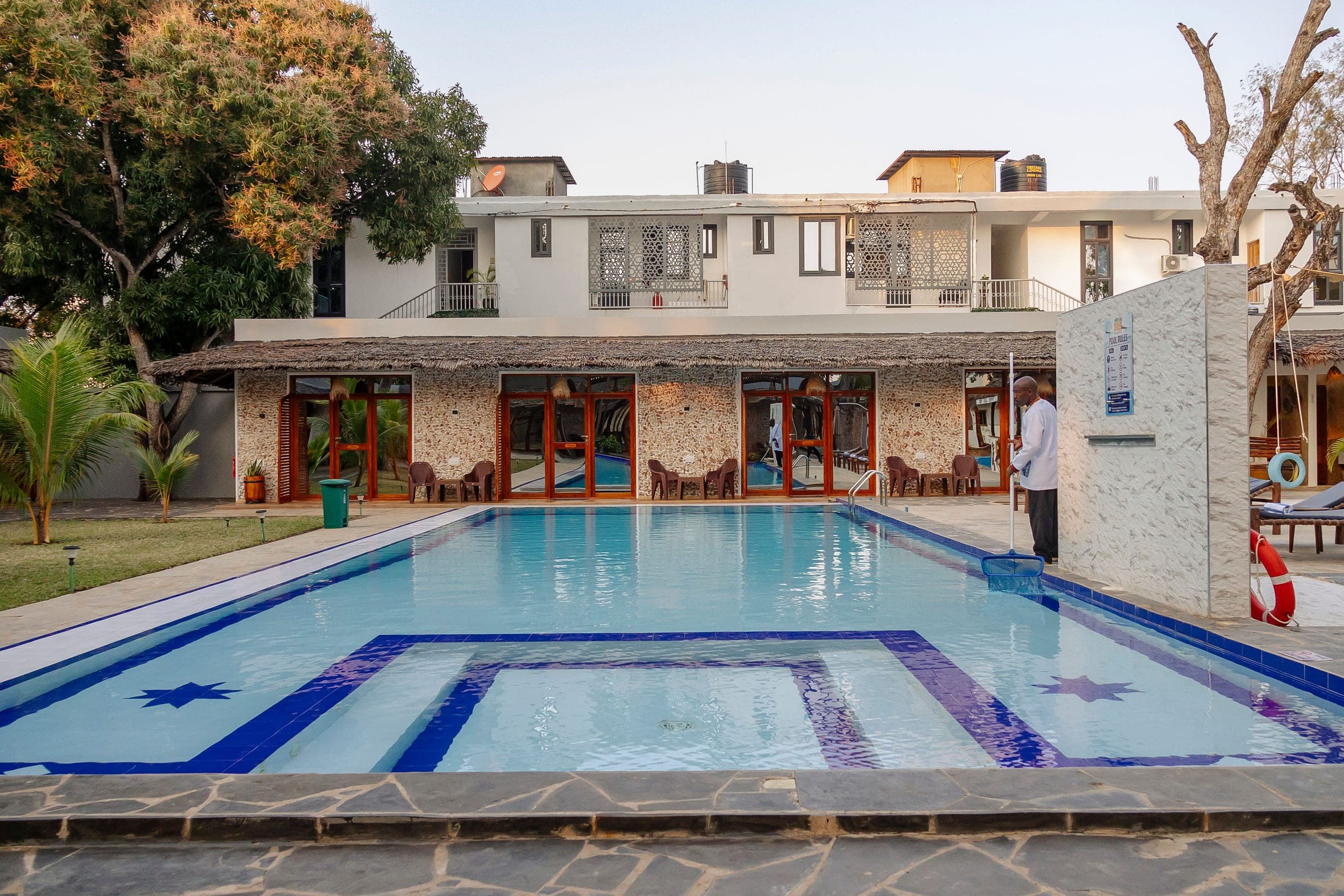 Sunset light across the pool and garden